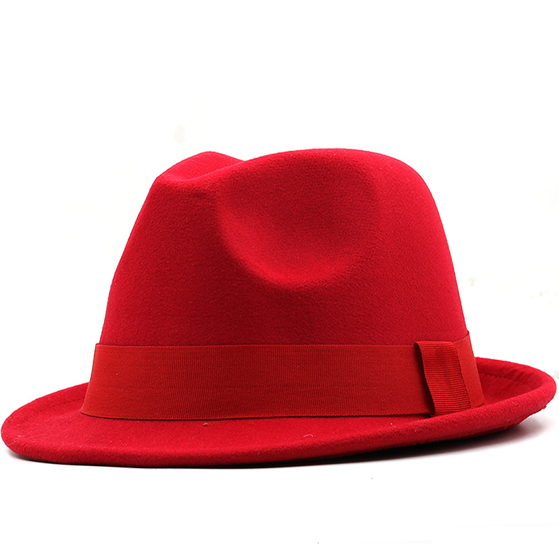 Red fedora with a matching ribbon band on a white background.