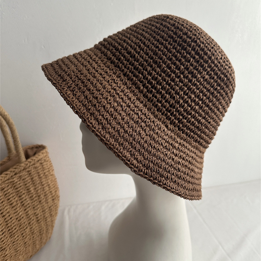 Coffee brown bucket hat with textured woven rows on a mannequin