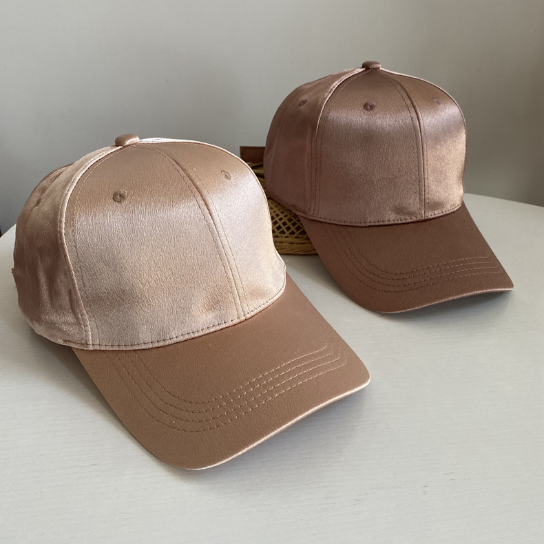 Two champagne satin baseball caps with contrasting brown curved visors