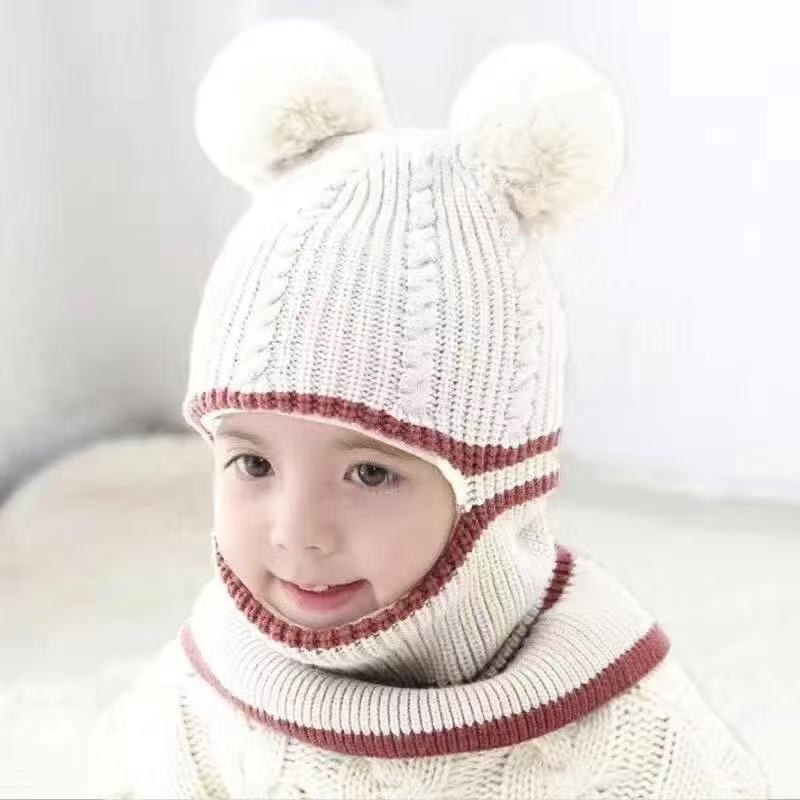 Off-white toddler knit beanie with burgundy trim, twin pom-poms and an integrated neck section.