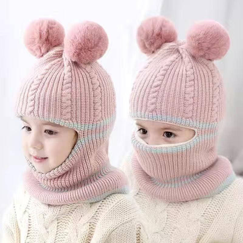 Pink toddler knit beanie shown with the lower section below the chin and raised over the lower face.
