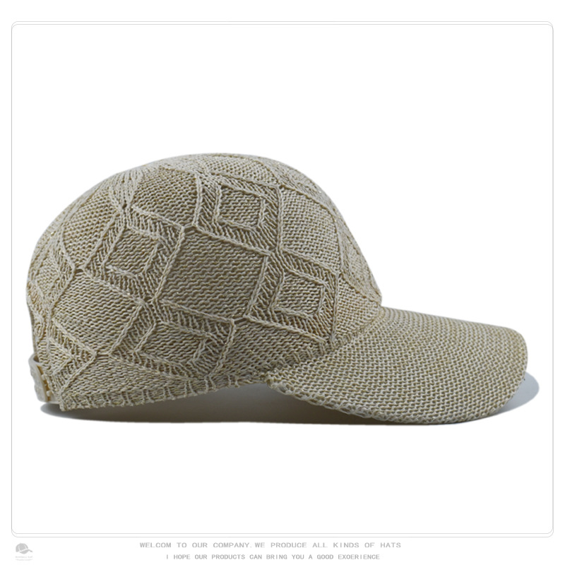 Opposite side view of a beige openwork knit baseball cap showing the knit crown and curved brim