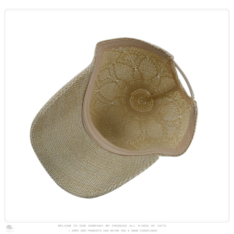 Inside view of a beige openwork knit baseball cap showing the inner band and knit construction