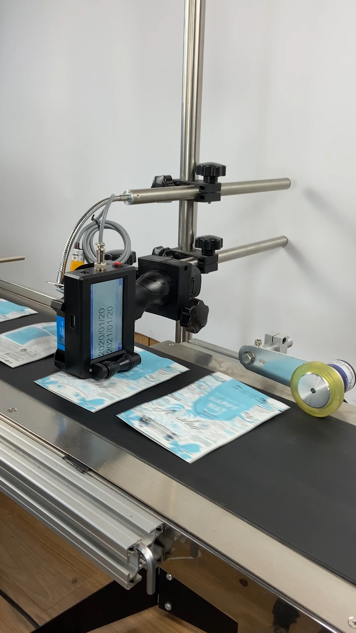 tij handheld printer with conveyor belt used for expiry date barcode printing in product production line 1