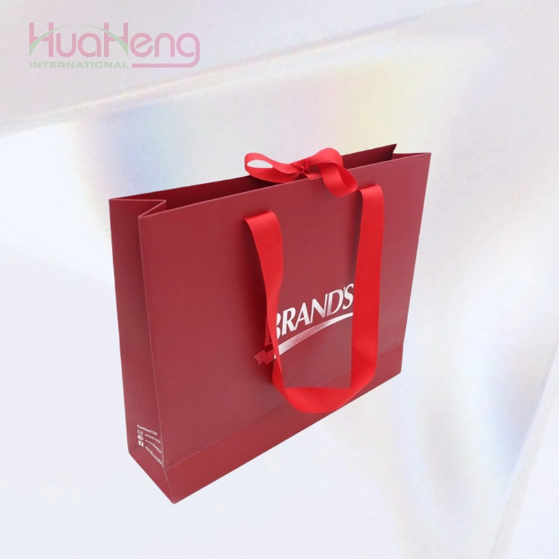 أكياس ورقية حمراء احتفالية من Hua Heng - عبوة نابضة بالحياة مستوحاة من الطراز الصيني للعطلات 1