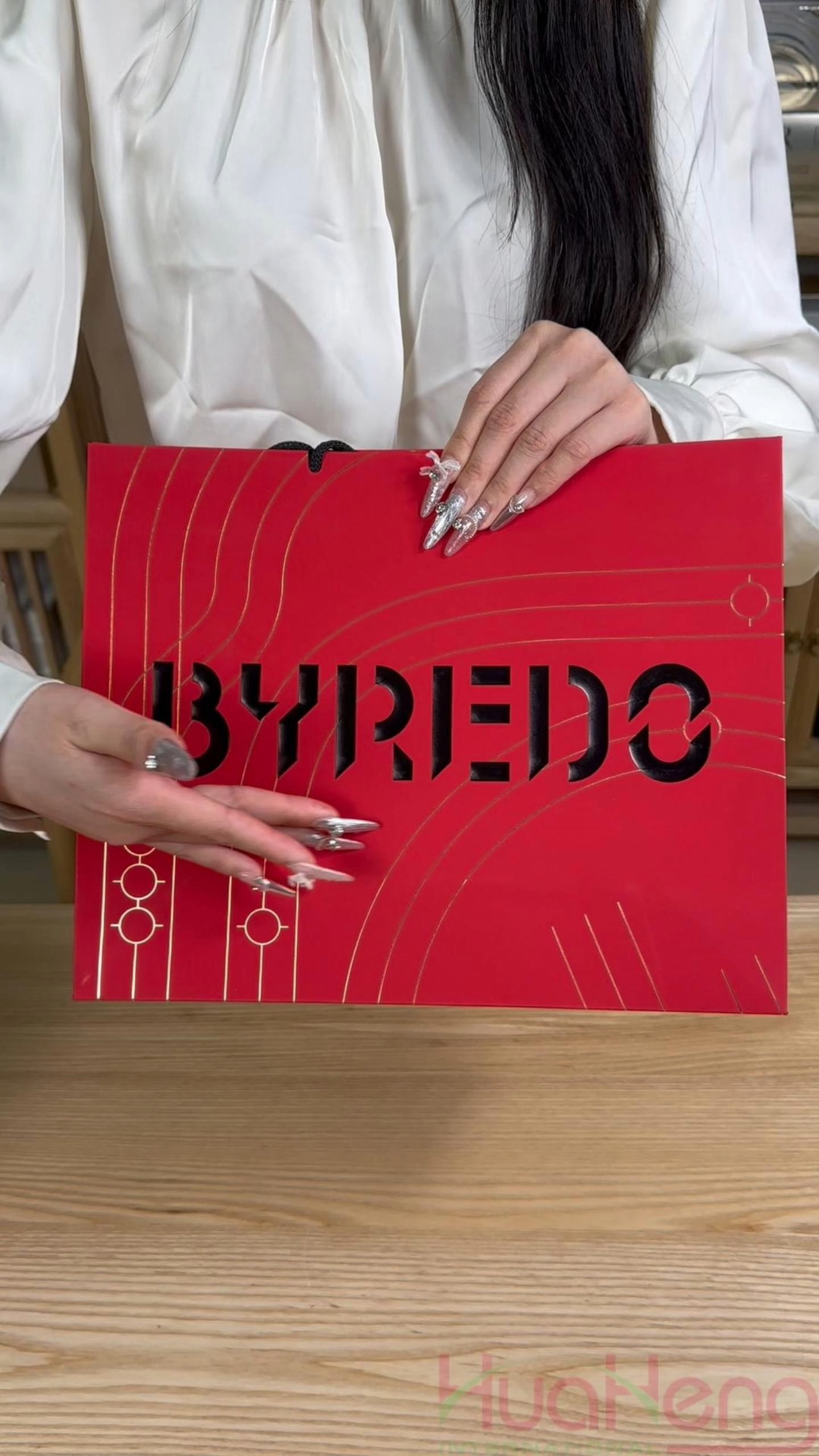 Elegant Elegance: The Super Premium Red Paper Bag with Gold Foil and Deboss Logo