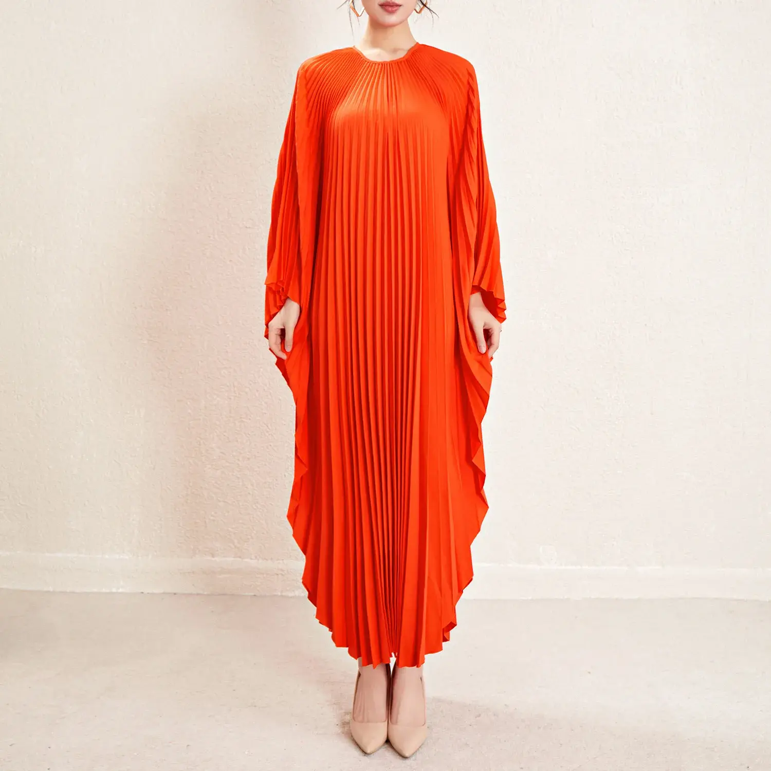 Stunning In Red: The Elegance Of A Pleated Dress 1