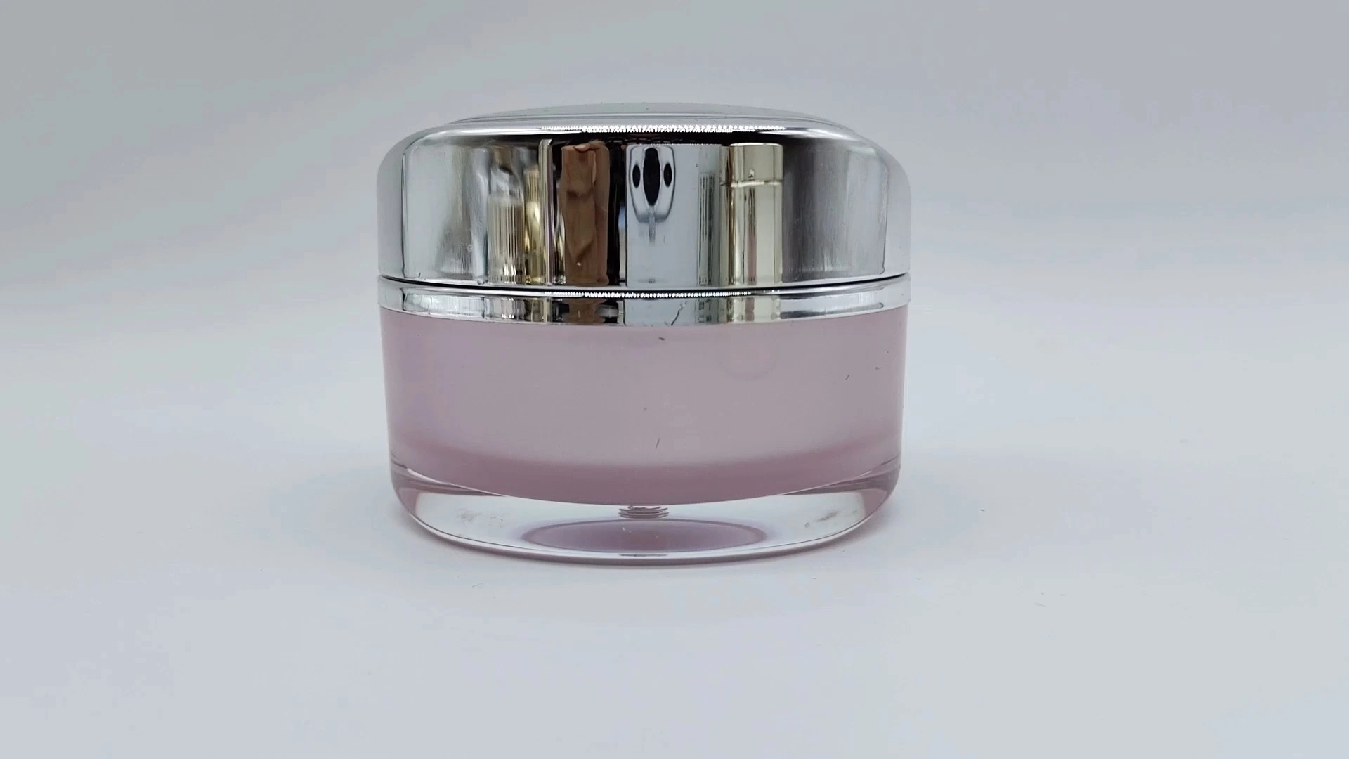 Envase para crema de 50 ml con interior rosa mate y recubrimiento galvanizado plateado. Envase para cosméticos. 1