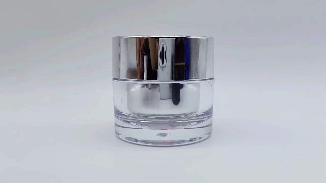 Envase redondo transparente de pared gruesa con interior plateado y acabado galvanizado de 50 ml de plástico PE-AS para cremas faciales y cuidado de la piel. Envase para cosméticos. 1