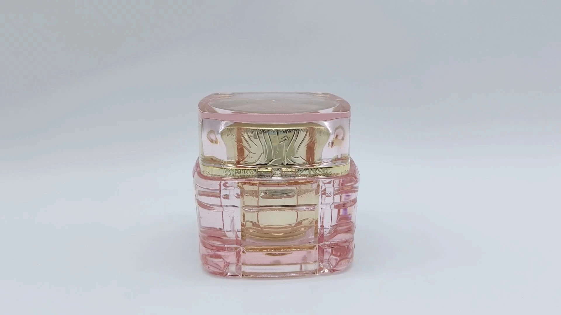 Elegante envase de crema facial de 40 ml con interior dorado y rosa cristalino, con tapón de rosca 1