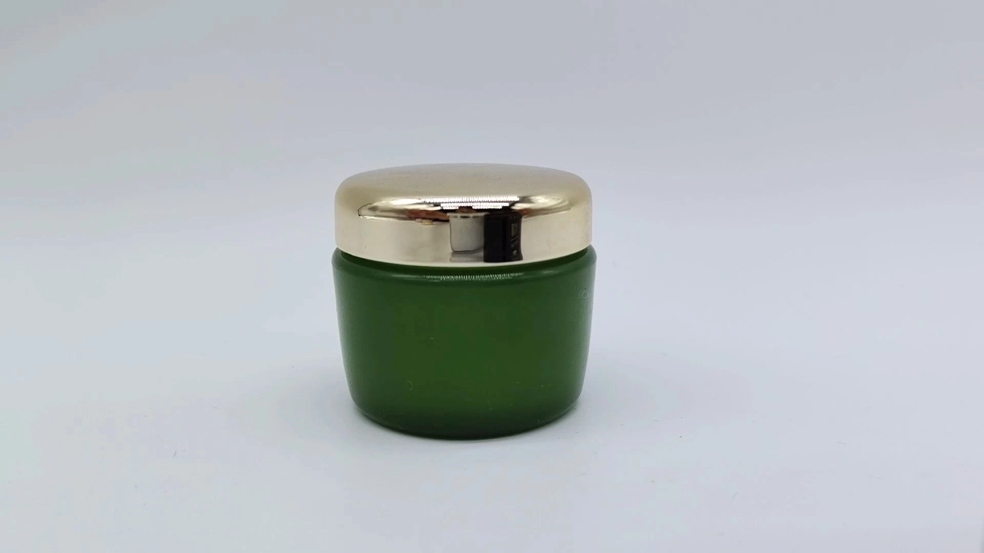 Envase de plástico PE-AS para cremas faciales y de manos, personalizado, redondo, con tapa verde y dorada, tamaño pequeño, 15 ml, para envases cosméticos. 1