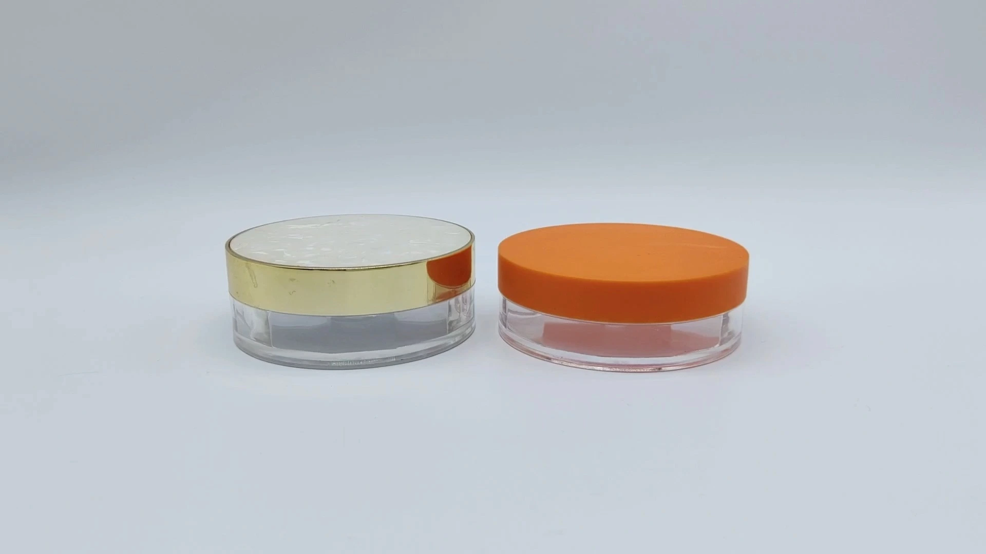 Envase de crema para el cuidado facial y de la piel, de plástico PE-AS, transparente, redondo, plano, OEM/ODM, con tapa dorada/naranja, de 40 ml, para envases cosméticos. 1