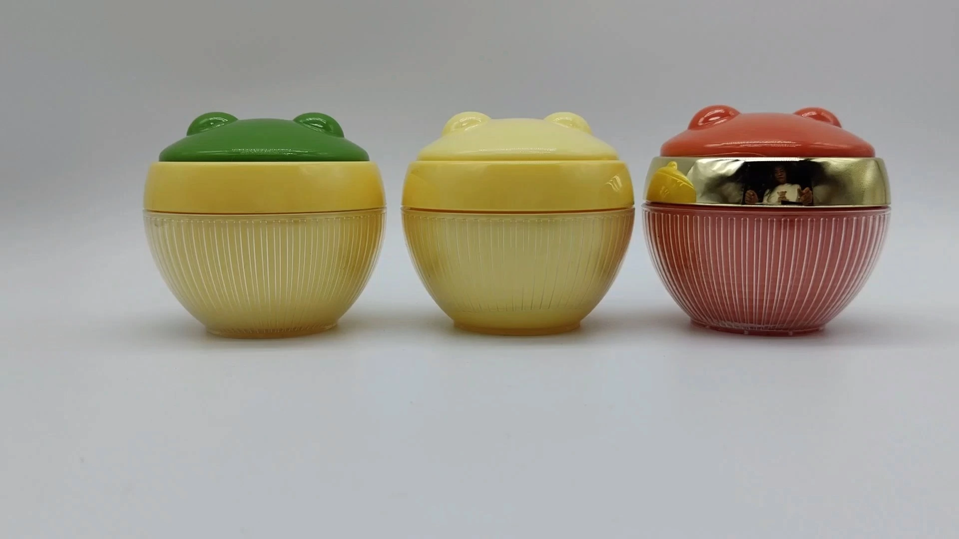 Envase de crema personalizado OEM con forma de rana infantil, verde, amarillo y rojo, de 50 ml, para cosméticos 1