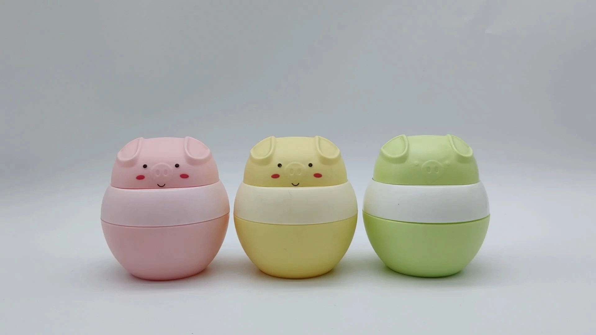 Envase de crema para el cuidado de la piel facial y de las manos de plástico PE de 45 ml, con diseño encantador de cerdito infantil, serie rosa, amarillo y verde, personalizado por OEM. 1