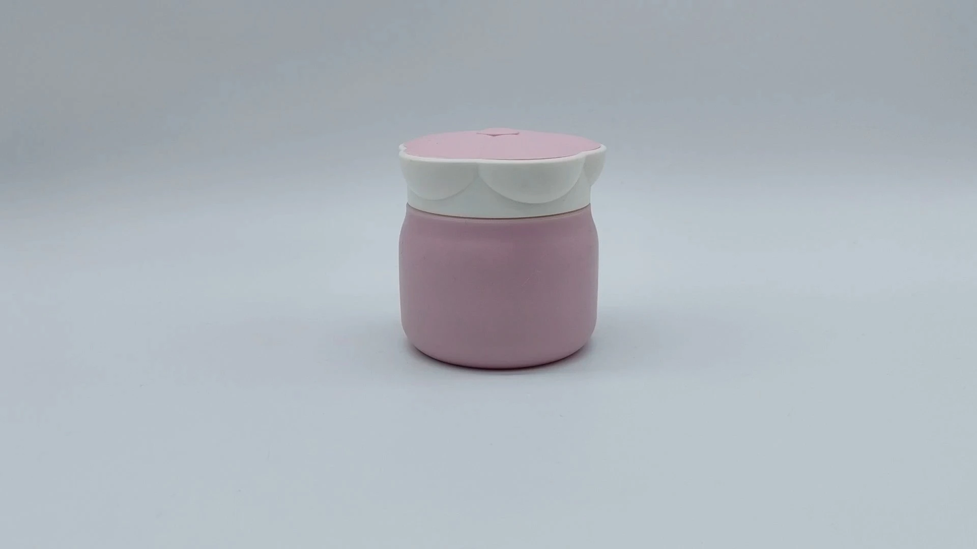 Envase de plástico PE de 50 ml para cremas faciales y de manos, con elegante diseño floral en rosa y blanco, ideal para el cuidado de la piel. 1