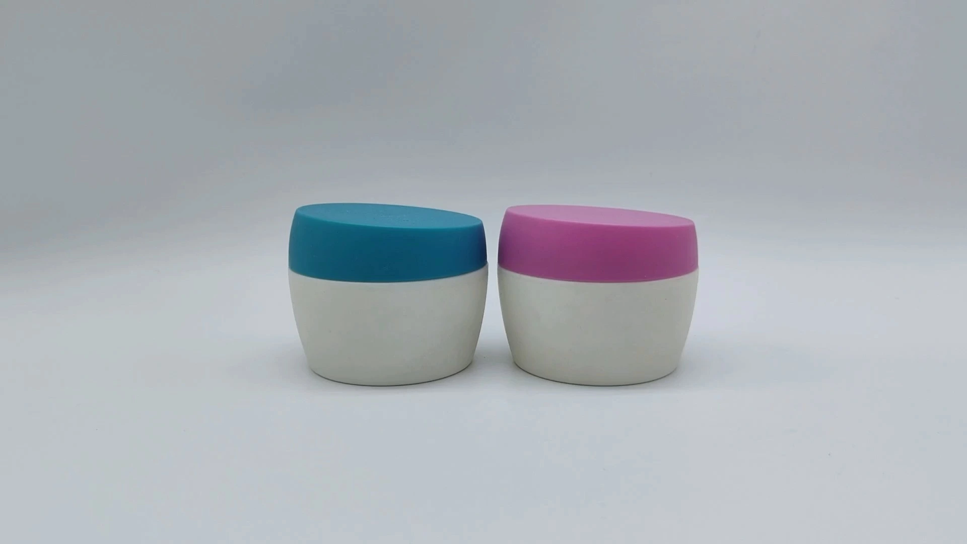 Envase de plástico PE de 45 ml para crema facial, cuidado de la piel, manos y pies, personalizado, de boca ancha, redondo, en dos colores, azul, blanco y morado. 1