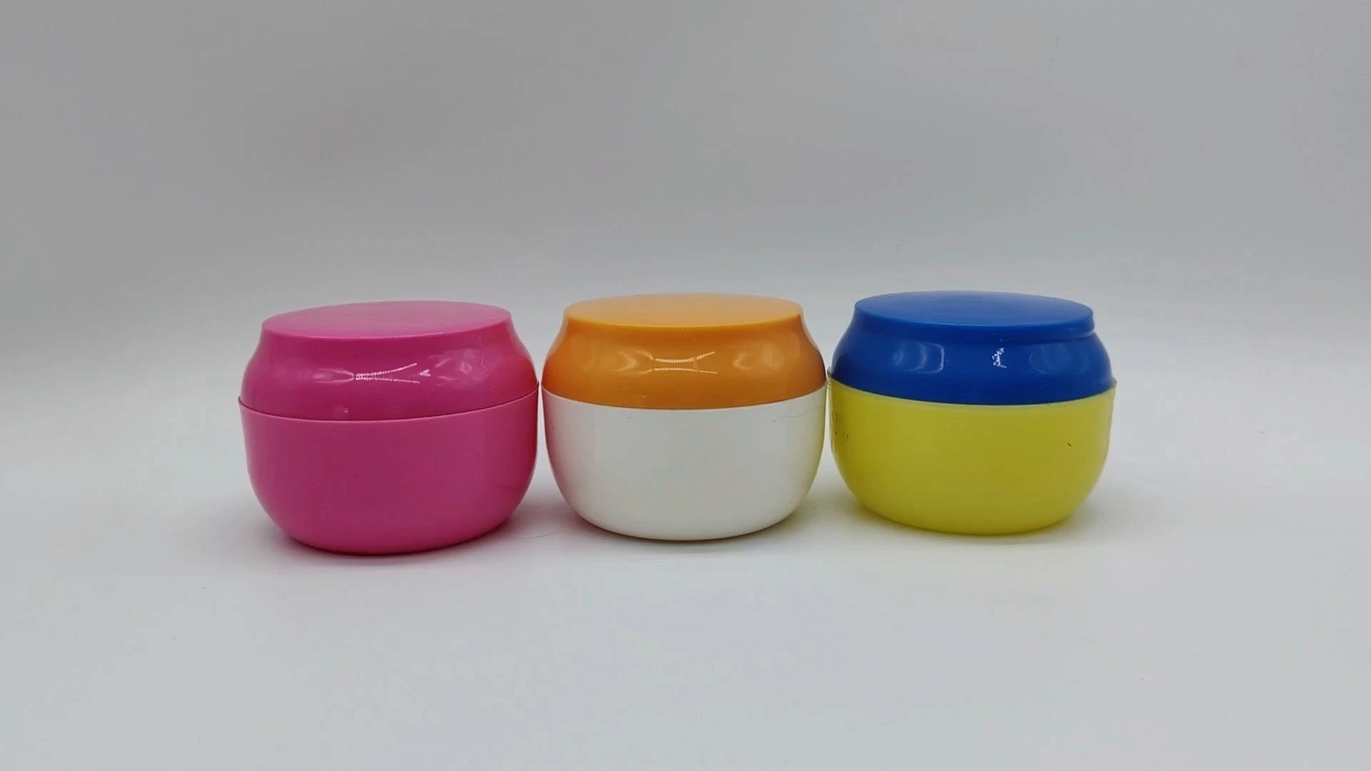 Frascos de plástico PE de 40 ml para cremas faciales, cuidado de la piel y manos, personalizados, de boca ancha y forma redonda, en varios colores. 1