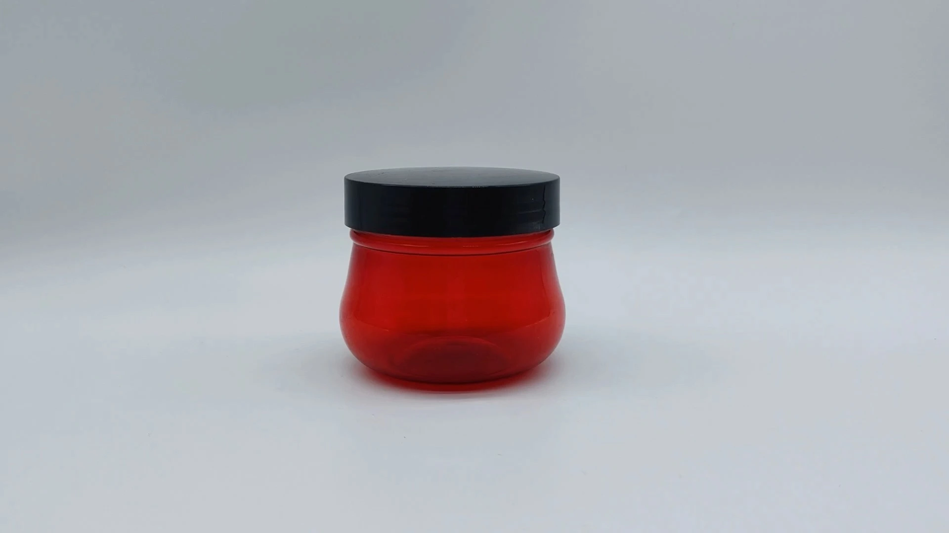 Frasco transparente rojo personalizado simple con tapa negra de 100 ml de plástico PE para crema facial y cuidado de la piel de las manos, envases cosméticos. 1