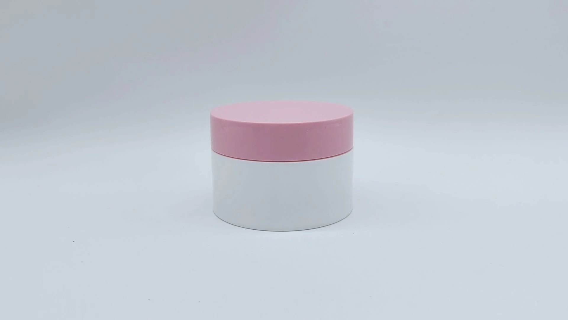 Heißer Verkauf Zylinderförmiges, anpassbares weißes Glas und rosa Schraubverschluss, entworfen für 50 ml Kunststoff-PE-Gesichts-Handhautpflegecremebehälter, Kosmetikverpackungsgläser 1