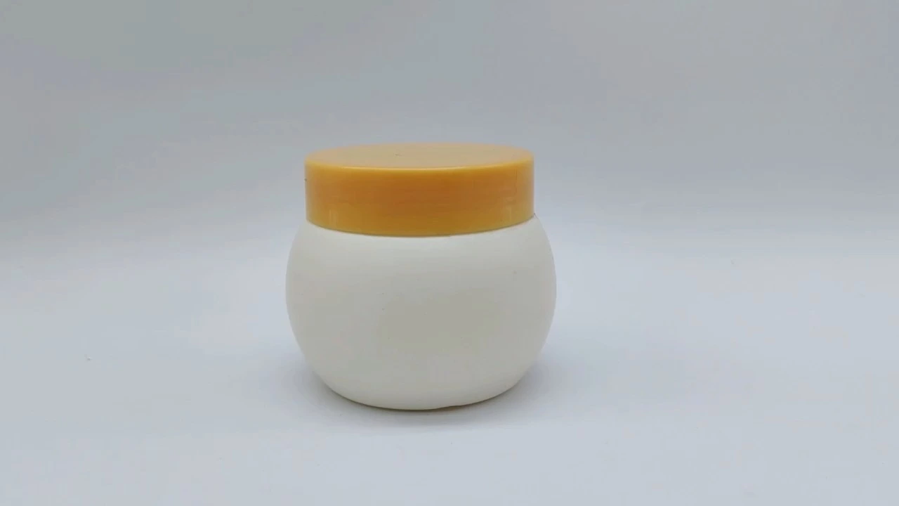 Envase redondo personalizado de plástico PE para cremas faciales y de manos, con tapa blanca mate y naranja, de 200 ml, para el cuidado de la piel y la piel. 1
