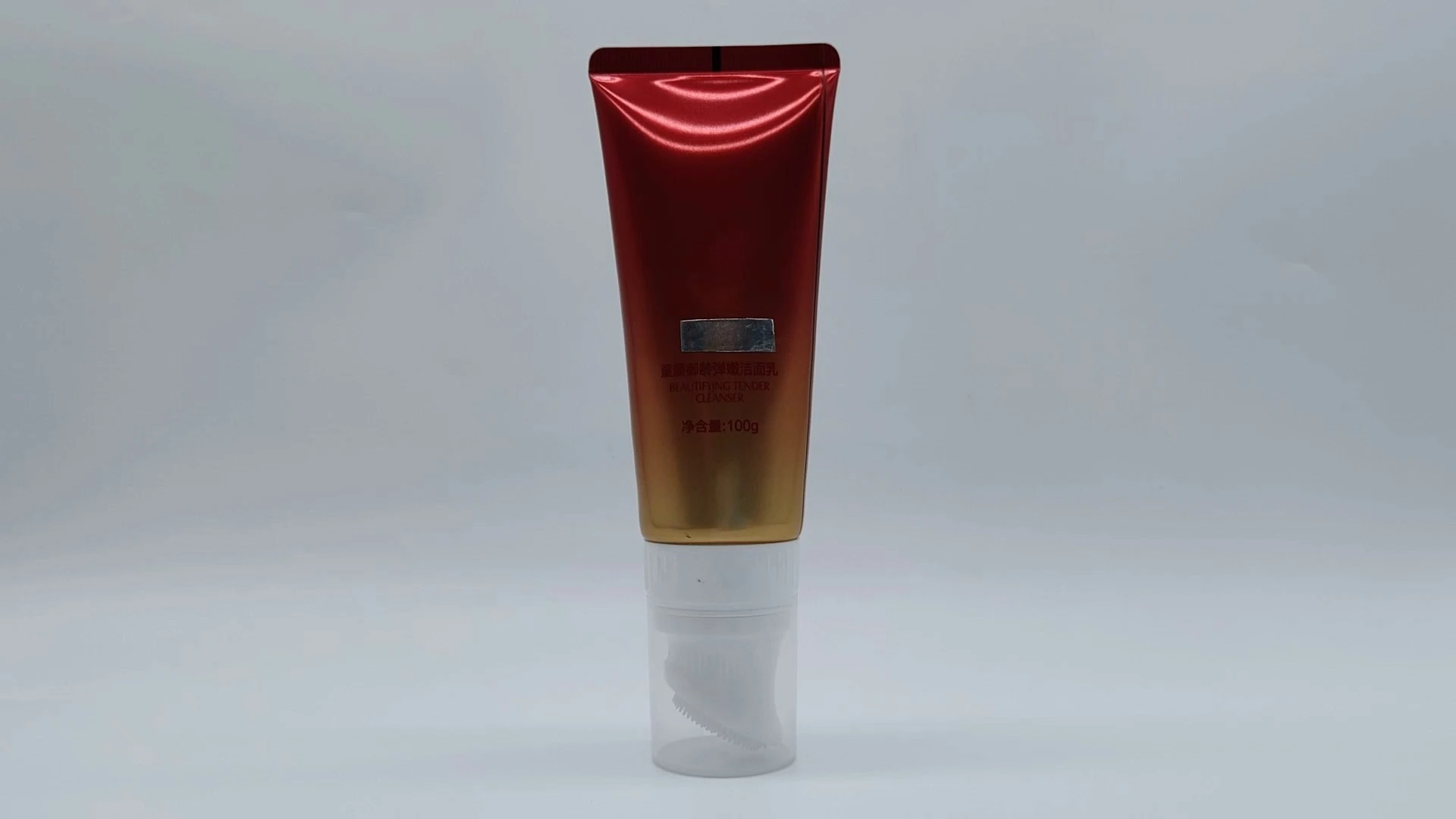 Tubo cosmético de plástico extraíble y glamuroso con aplicador de gel de ducha y cepillo de silicona para limpiador facial o loción corporal. 1