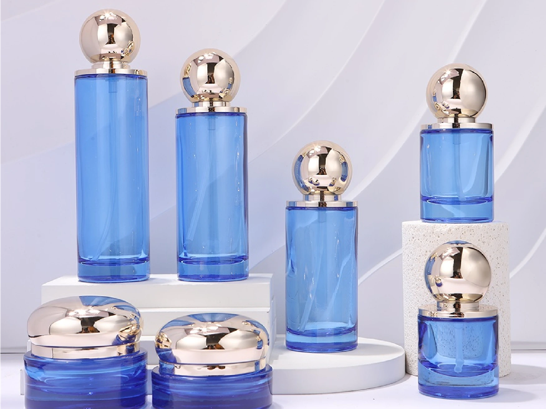 Bright Blue Transparent with Gold Ball Cap Skincare Packaging Set | 150/120/100/50/30ml Bottles & 100/50/30g Jars for Hydrating Skincare Lines 1