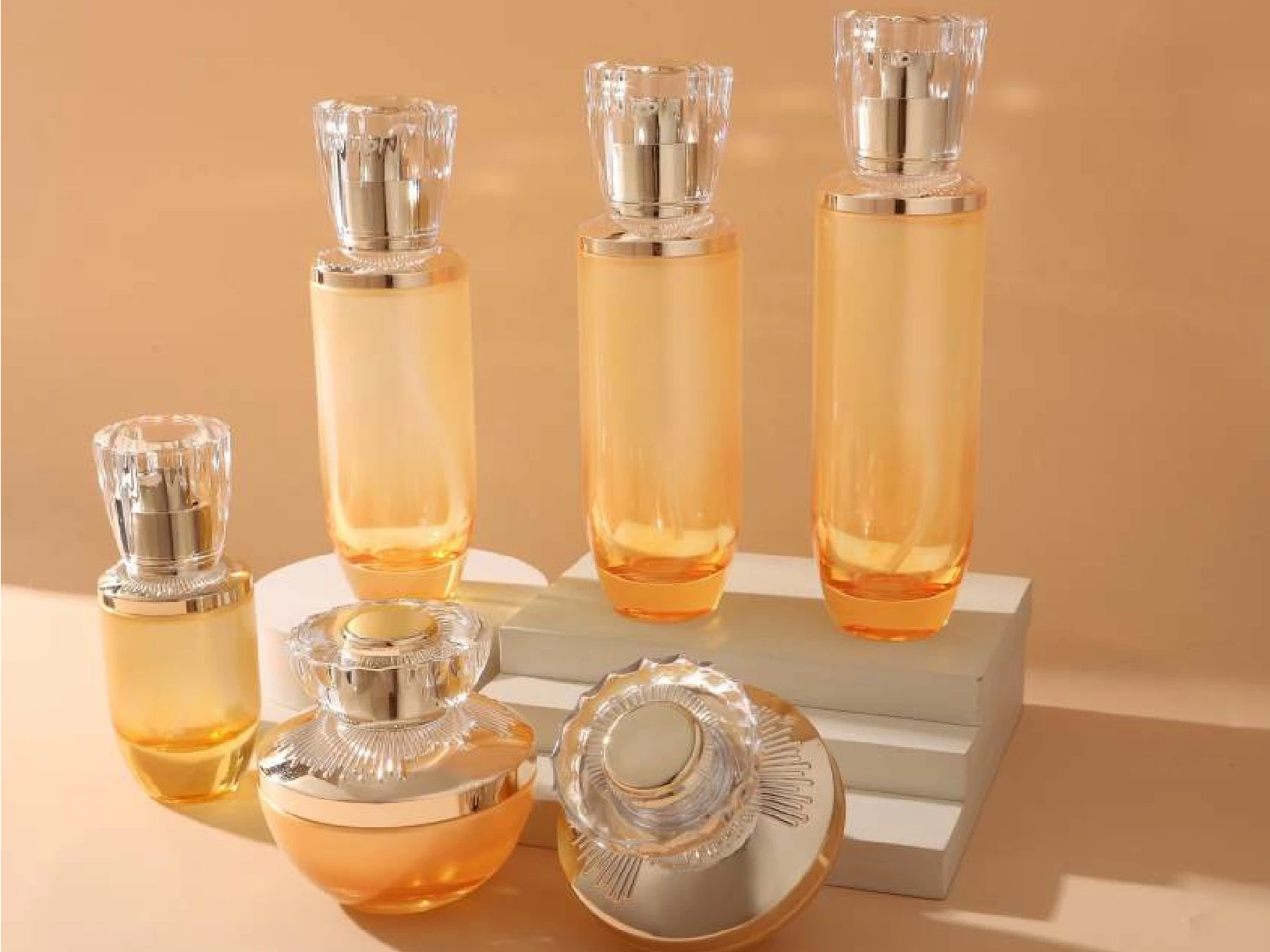 Amber Orange Gradient with Faceted Crystal Cap Skincare Packaging Set | 150/120/100/40ml Bottles & 50/30g Jars for Luxury Anti-Aging Lines 1