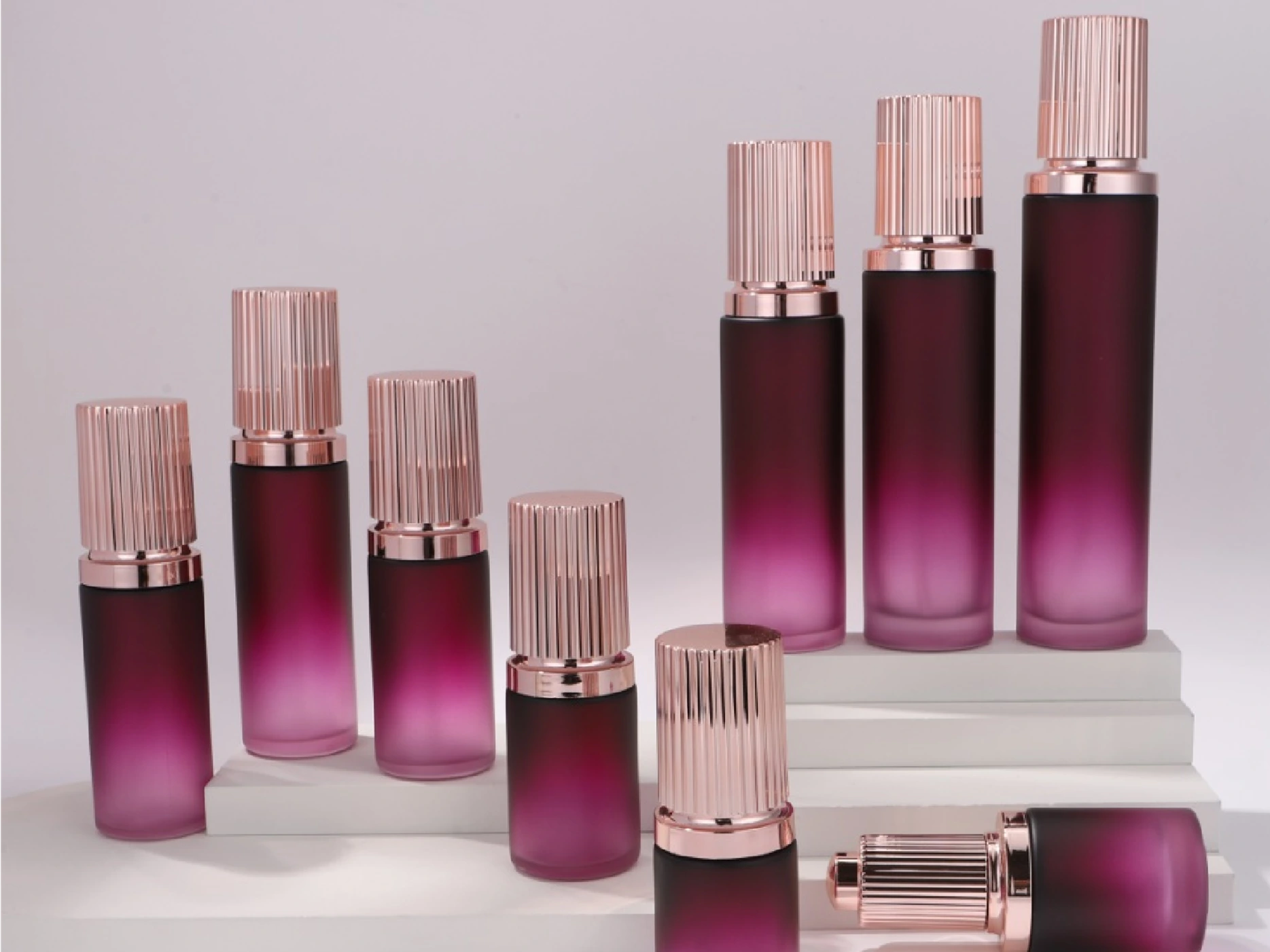 Plum-Pink Gradient Skincare Packaging Set with Ribbed Rose Gold Caps | 120/100/80/60/50/40/30/20ml Bottles & 50/30g Jars for Luxury Anti-Aging Lines 1