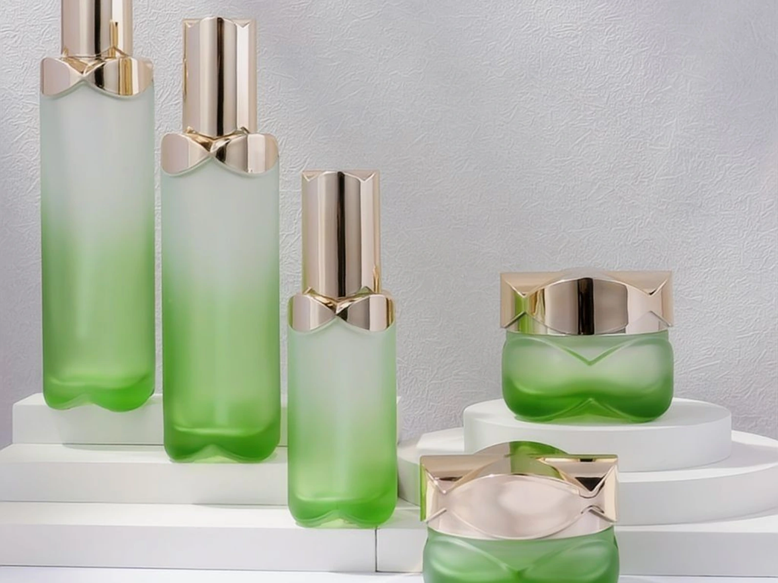 Green Gradient Skincare Packaging Set with Geometric Gold Caps | 120/100/40ml Bottles & 50/30g Jars for Refreshing Botanical Lines 1
