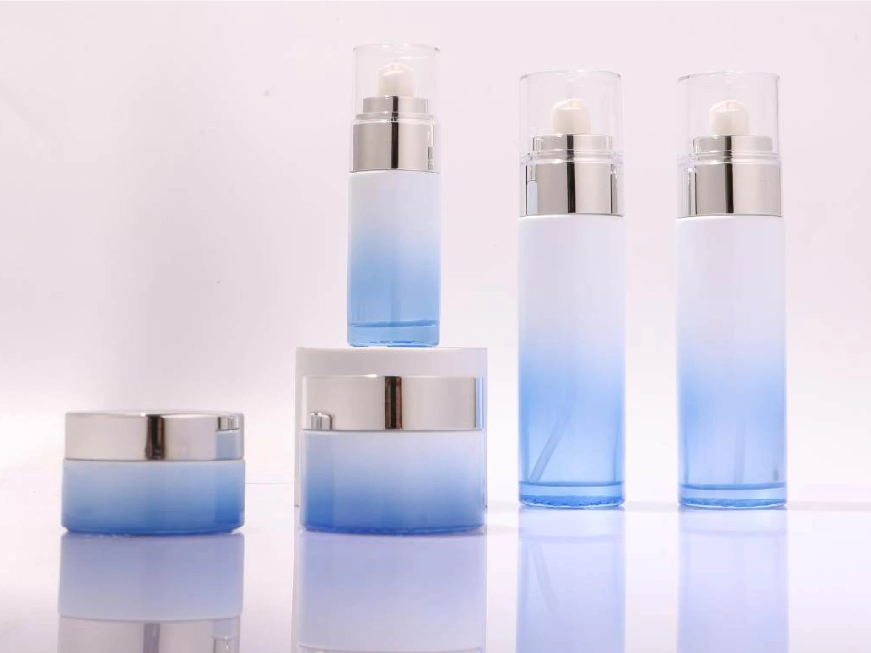 White-Blue Gradient Skincare Packaging Set with Silver & Crystal Caps | 120/100/40ml Bottles & 50/30g Jars for Refreshing Hydration Lines 1