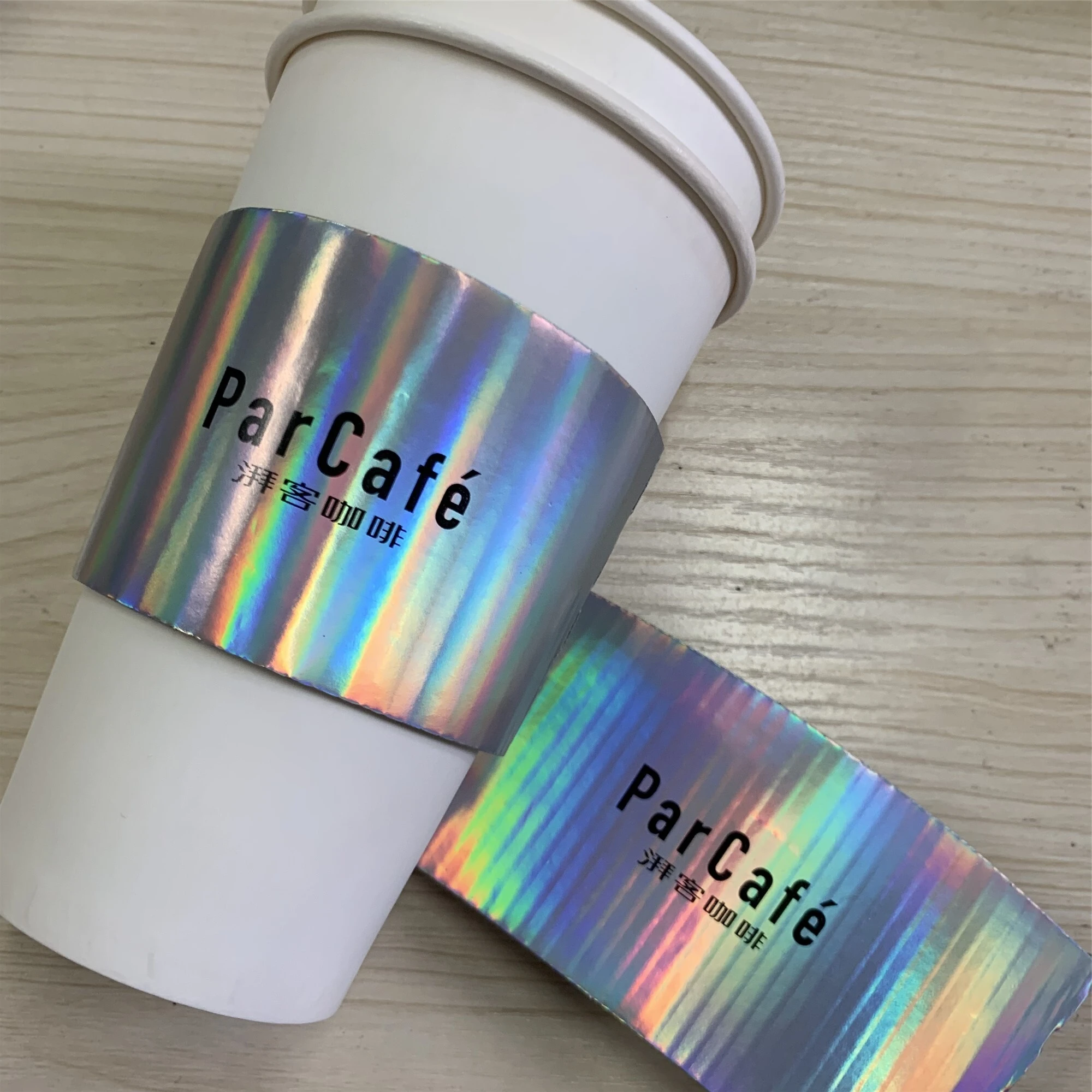 Uchampak- wholesale manufacturer holographic/laser film printing customized cupsleeves Cup Sleeves 1
