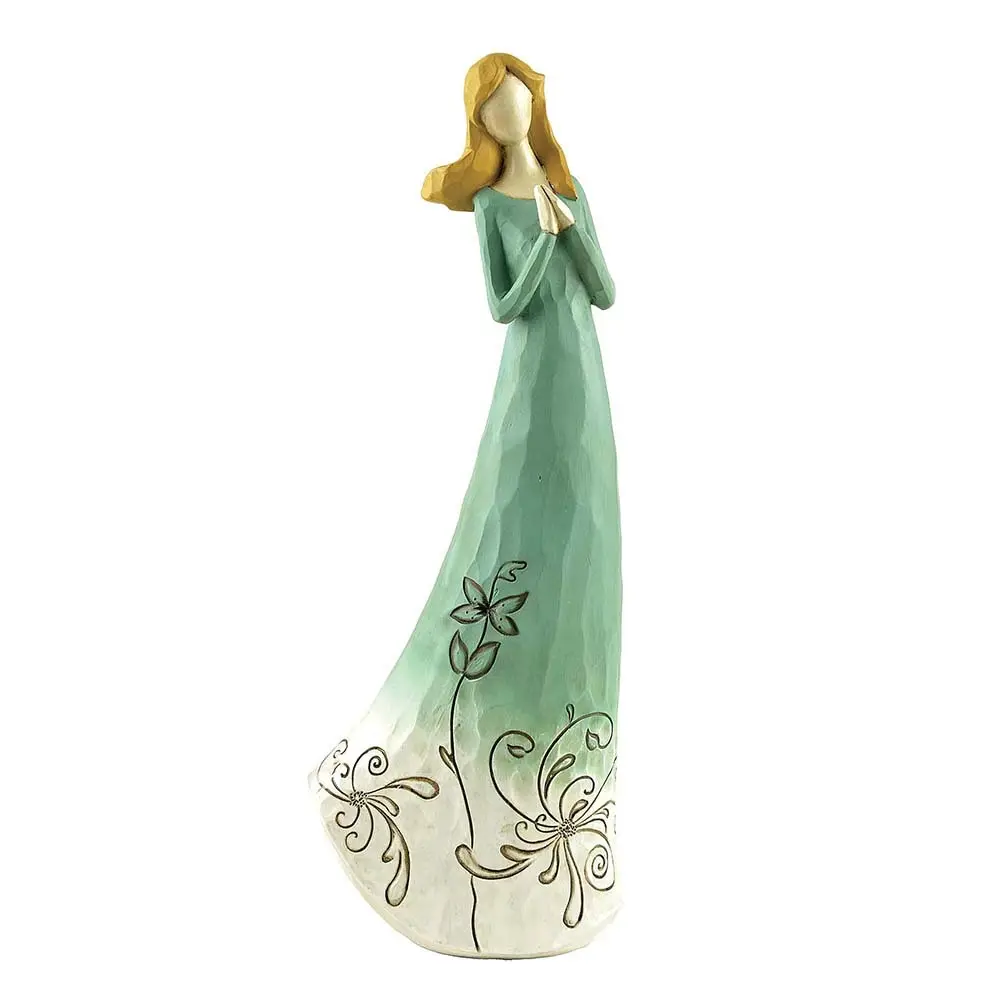 carved angel figurines colored for decoration 1