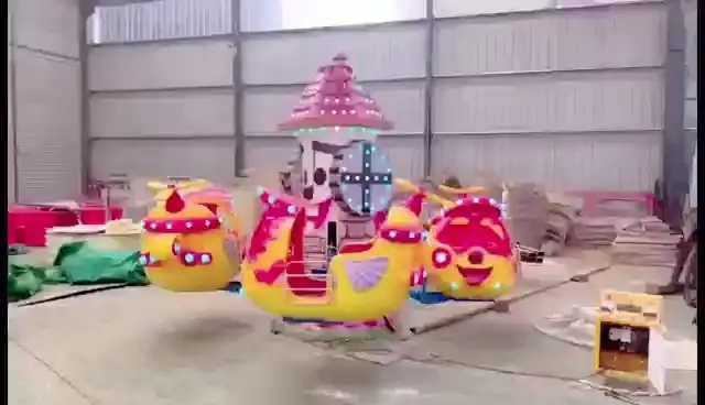 Big - Eyed Aircraft Amusement Ride: Colorful, Rotating Cartoon - Styled Fun 1