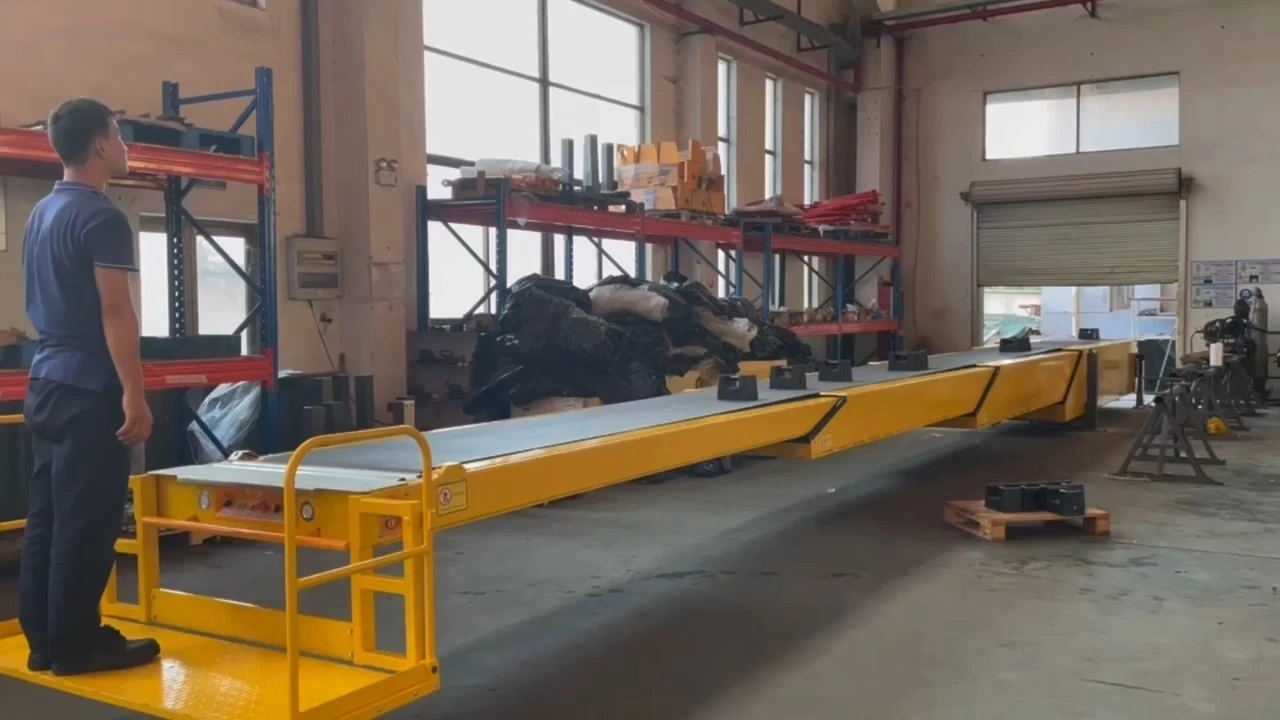 Fixed telescopic conveyor truck unloading to pallet with operator platform1 1