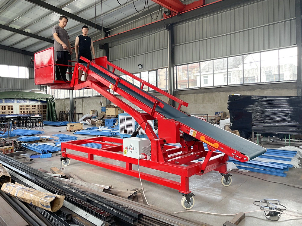 Transportador de carga y descarga de camiones con plataforma de pie para trabajadores 1