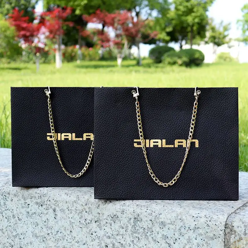 2023-new-black-luxury-paper-shopping-bag-with-hardware-chain-handles 1