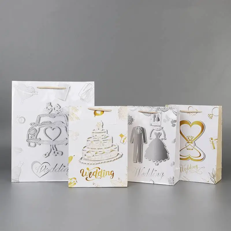 China Manufacturer Wholesale White Wedding Theme Paper Gift Bags Wth Tags 1