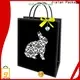 comprar proveedor de bolsas de regalo negras para embalaje de regalos navideños 1