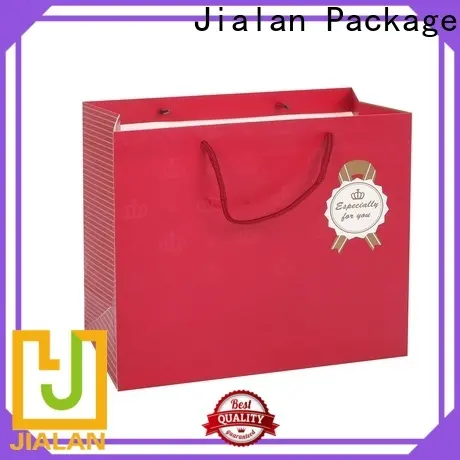 Jialan أكياس هدايا بنية اللون مع مقابض مصنعة لتغليف هدايا عيد الميلاد 1