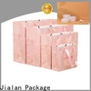 Jialan Paquete de fábrica de bolsas de papel personalizadas baratas para embalaje de regalos navideños 1