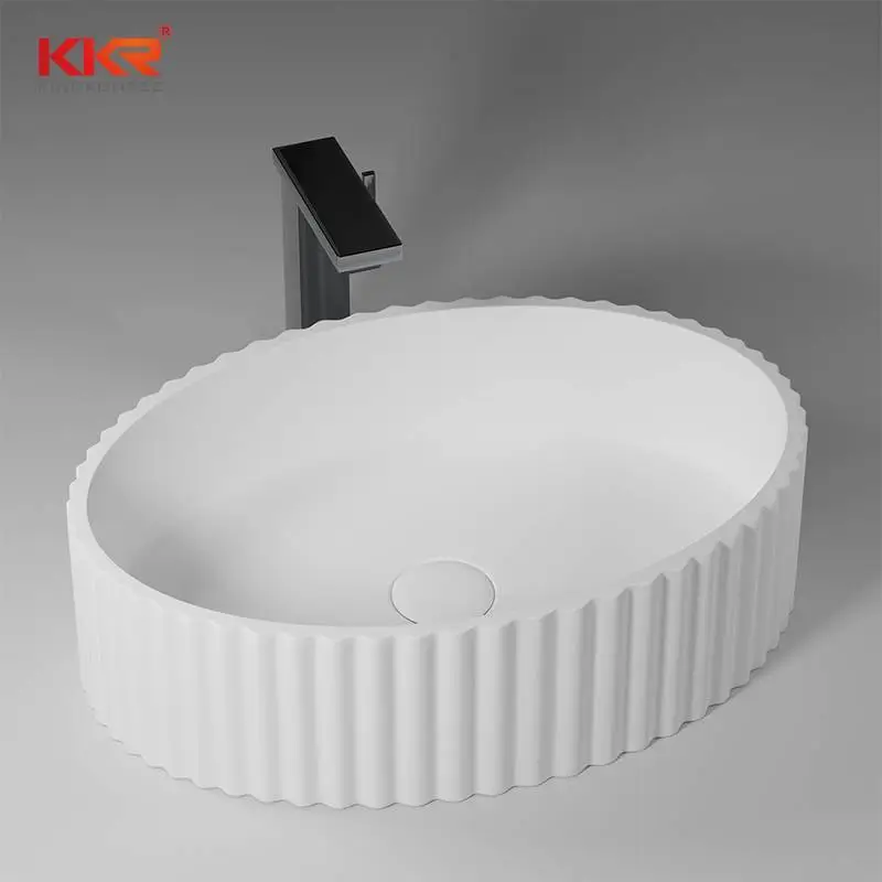 Lavabo ovalado sobre encimera de baño moderno con diseño ondulado en el exterior KKR-1169 1