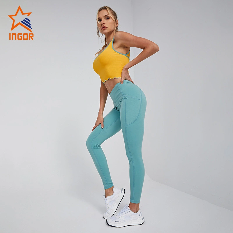 Produttore di abbigliamento sportivo personalizzato Ingorsports Reggiseno sportivo con rilegatura in colore a contrasto & Set di leggings da yoga con due tasche laterali senza cucitura frontale 1