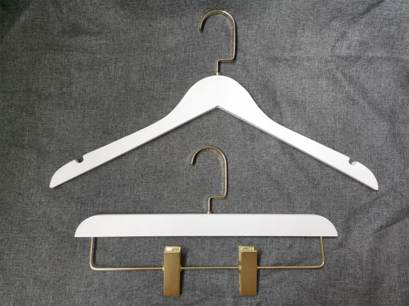 White coat hanger with gold metal 1