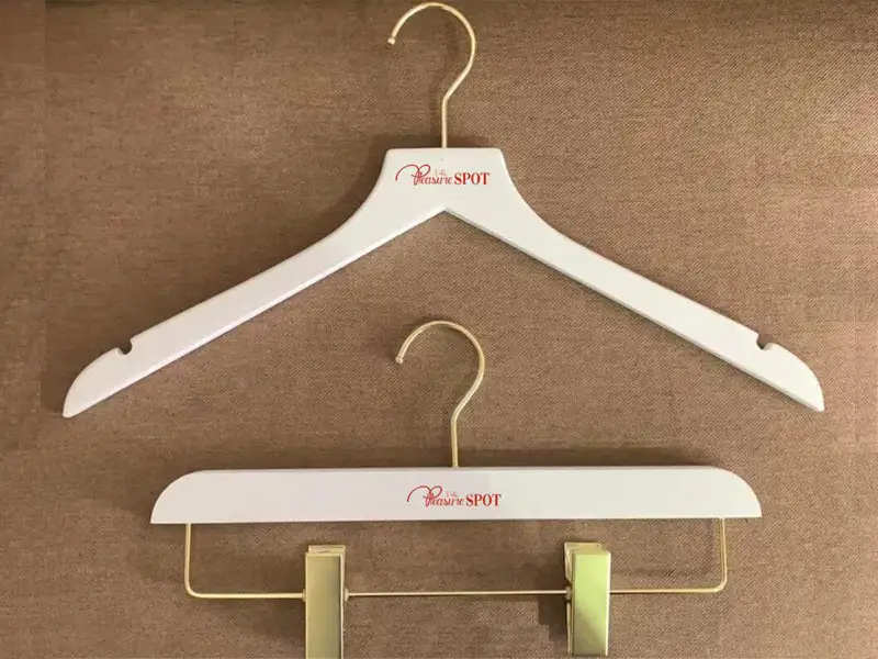 White wooden hanger with custom logo 1