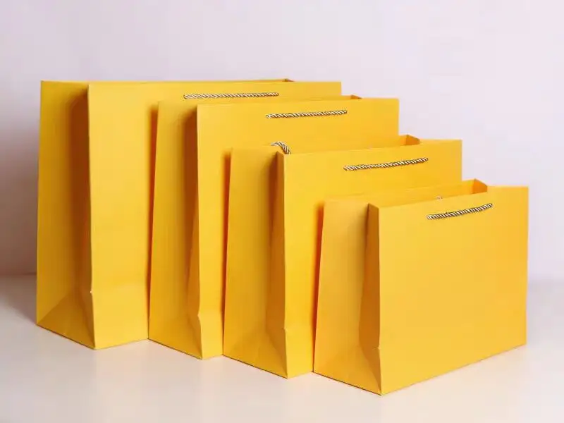 Carboard material paper abg in yellow color ,custom paper bag with logo 1