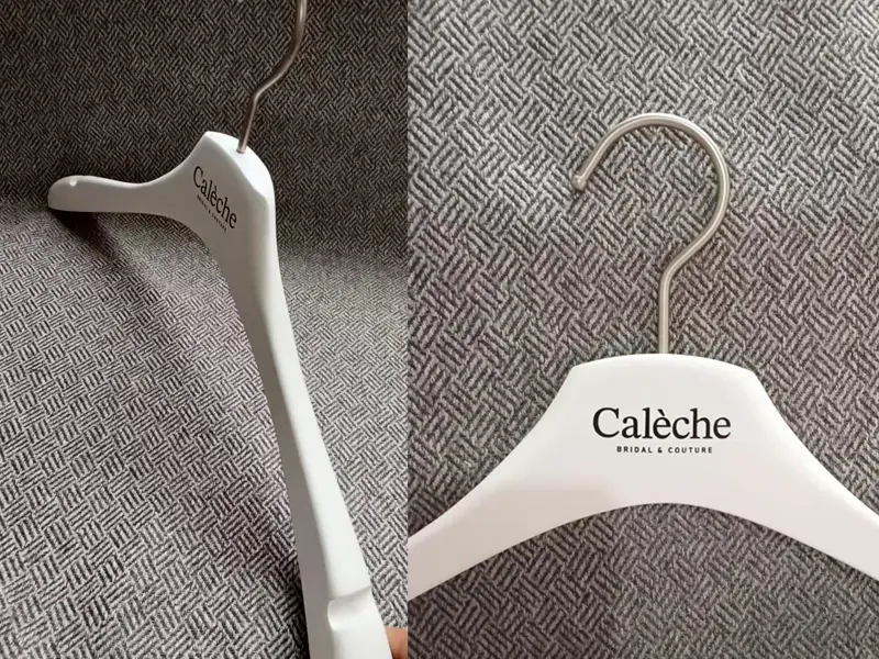 Matt white luxury wooden coats hanger with black logo 1