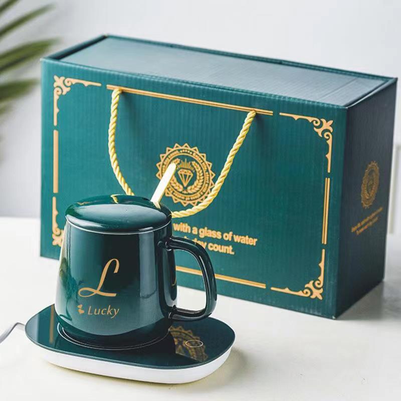 Smeraldaj ceramikaj kafaj tasoj reuzeblaj luksaj porcelanaj tasoj Fabrikisto Donaca Skatolo kun hejtilo 220V Propra Logo 10