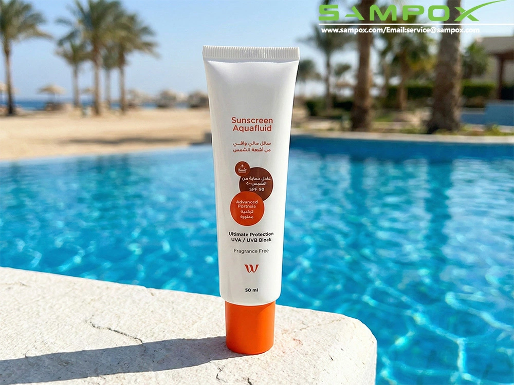 Biała tubka z PE z kremem przeciwsłonecznym, pomarańczową nakrętką i dyszą, 50 ml, 30 mm 1