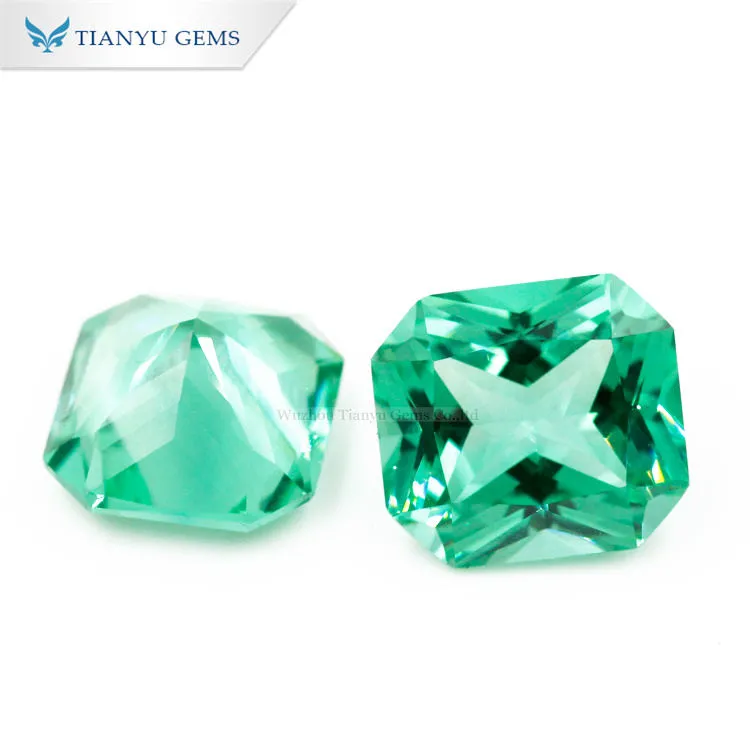 Premium Photo | A Green And Blue Emerald Piece With A Green And White